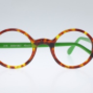 Wissing [2515/2269/2827]. Features circular shape in gorgeous havana with bright green temples.